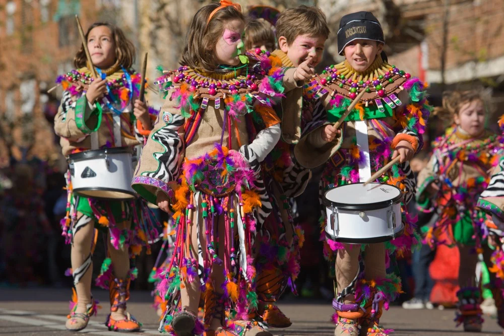 Child in costume taking part in a carnival parade in Spain