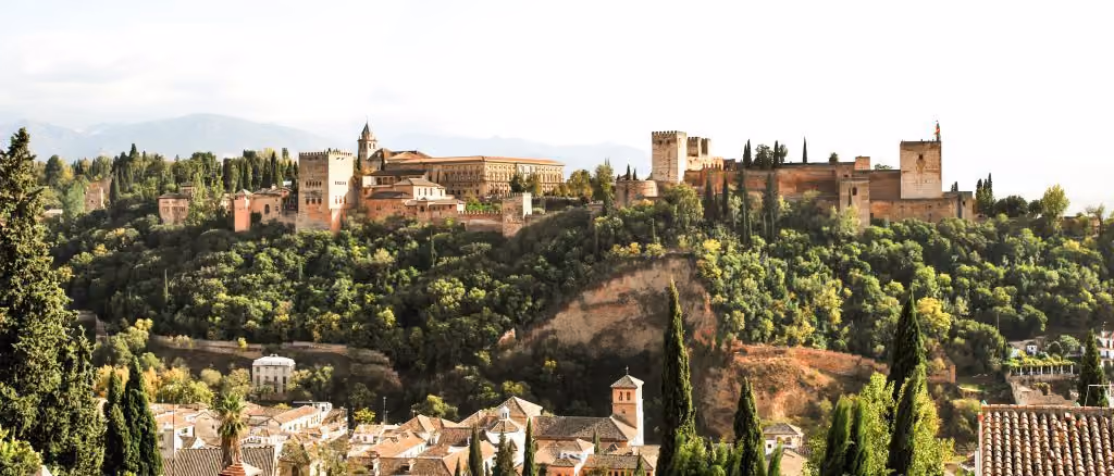 View of the Alhambra in Granada, between heritage and nature, reflecting Spain's rental potential in 2025.