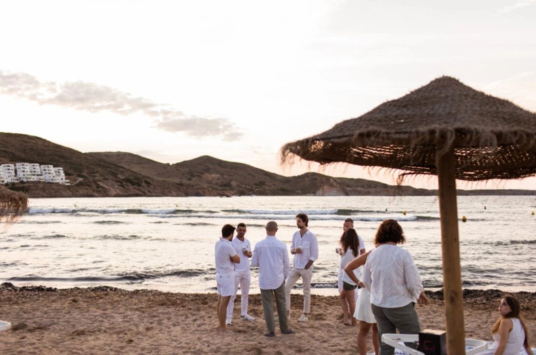 Alveo Search clients and team gathered on a beach on the Costa Blanca